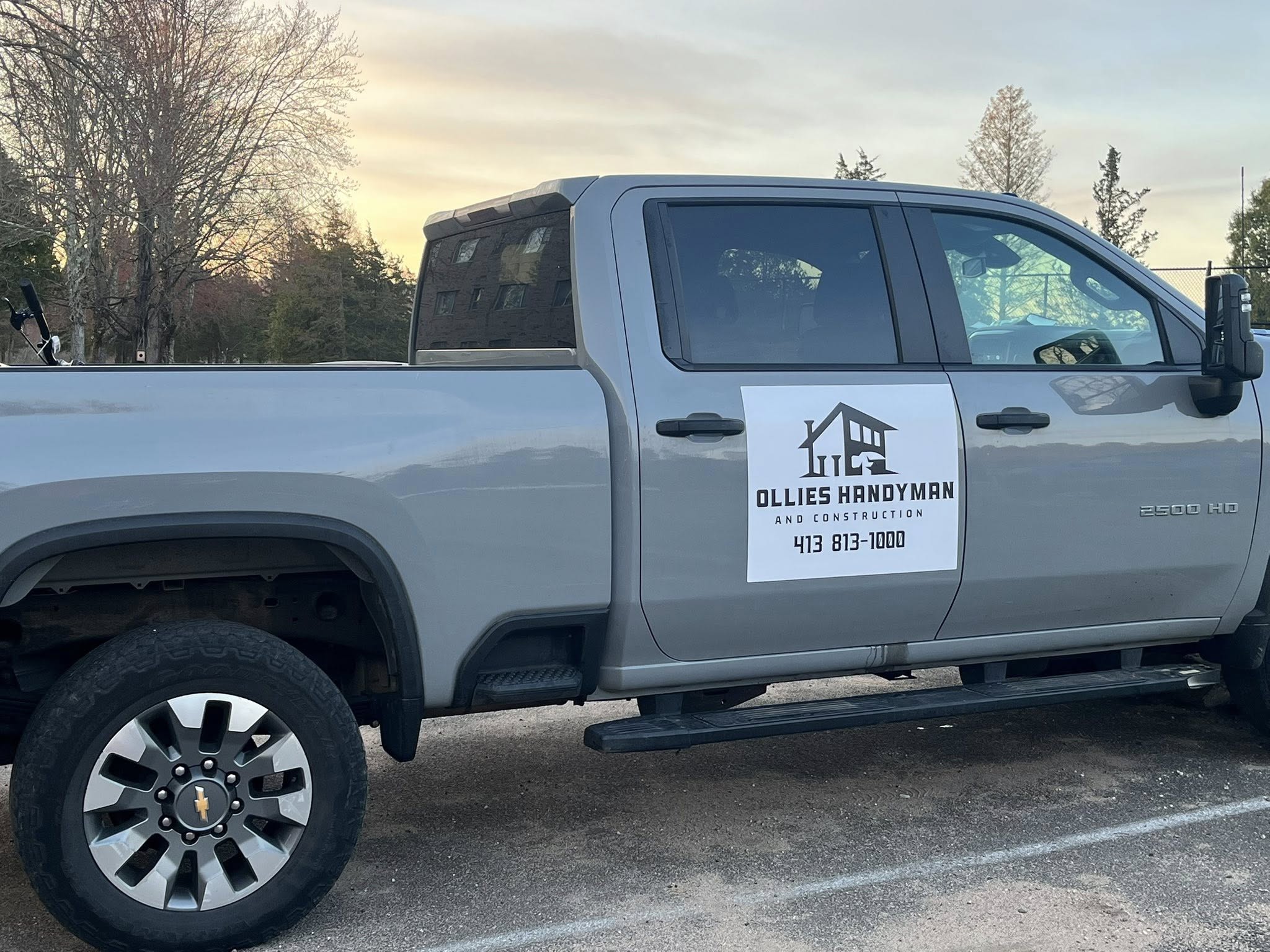 Ollies Handyman and Construction branded service truck